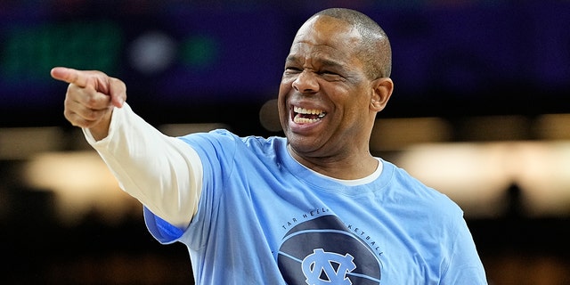 North Carolina head coach Hubert Davis points during practice for the men's Final Four NCAA college basketball tournament, Friday, April 1, 2022, in New Orleans.