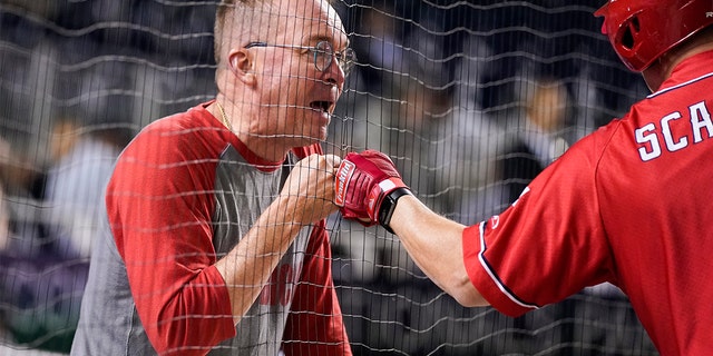 Former White House chief of staff Mick Mulvaney fist bumps House Minority Whip Steve Scalise during the first inning of the Congressional Baseball Game at Nationals Park, Sept. 29, 2021, in Washington.