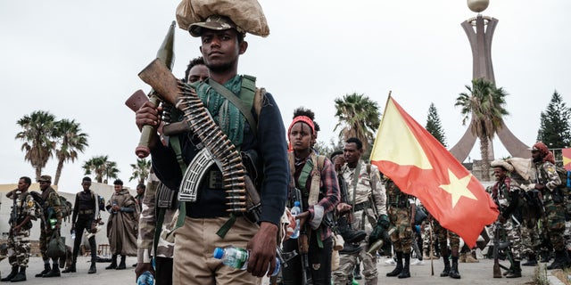 TOPSHOT - Tigray People's Liberation Front (TPLF) fighters prepare to leave for another field at Tigray Martyr's Memorial Monument Center in Mekele, the capital of Tigray region, Ethiopia, on June 30, 2021.