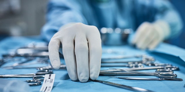 Surgeon prepares his tools