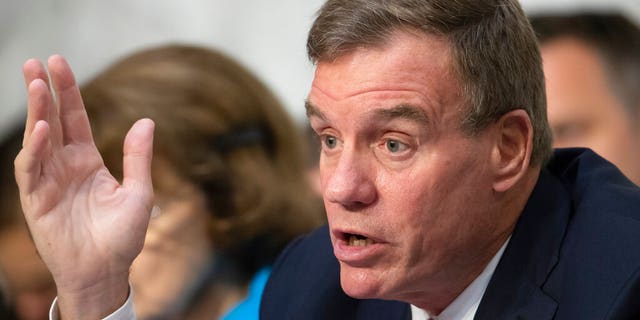 FILE - This Wednesday July 25, 2018 file photo shows Sen. Mark Warner, D-Va., vice-chair of the Senate Intelligence Committee, in Washington. Warner and Republican challenger Daniel Gade participated in a virtual debate in Northern Virginia earlier in the day.